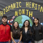 Students in front of Hispanic Heritage Month display